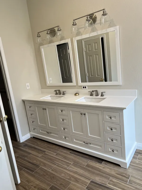 Double vanity with a quartz-look top, twin undermount basins and brushed-nickel fixtures, McKinney TX